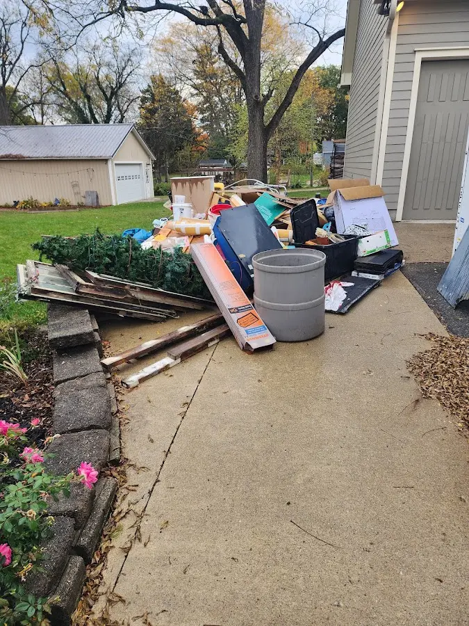Dumpster being loaded with debris for Residential Dumpster Rental in Edinburg